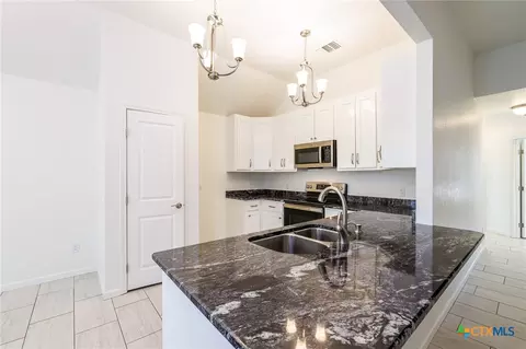 Kitchen - 228 Plum St, Luling, TX 78648 photo 1 of 2
