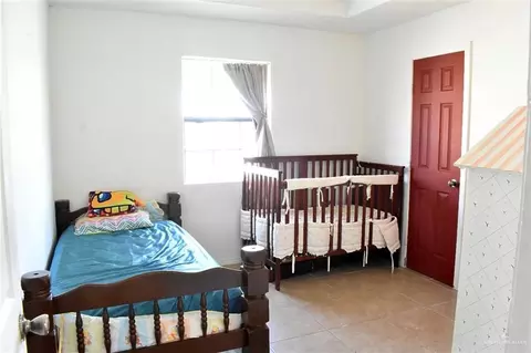 Bedroom - 712 E Vfw Ave, Elsa, TX 78543 photo 2 of 4