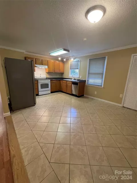 Kitchen - 305 Spring St, Bethune, SC 29009 photo 3 of 4