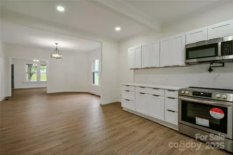 Living - 307 E 2nd St, Lowell, NC 28098 photo 4 of 4