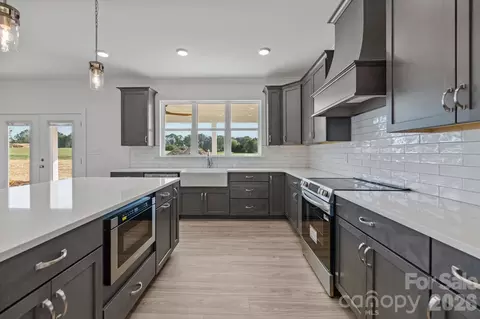 Kitchen - 2435 Wolf Pond 2 Rd #2, Monroe, NC 28112 photo 5 of 5