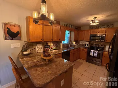 Kitchen - 110 E Pine St, Maiden, NC 28650 photo 1 of 2