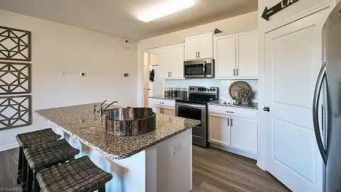 Kitchen - 8590 Cripple Gate Trce, Browns Summit, NC 27214 photo 2 of 4