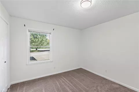 Bedroom - 300 Main St E #E, Pilot Mountain, NC 27041 photo 2 of 3
