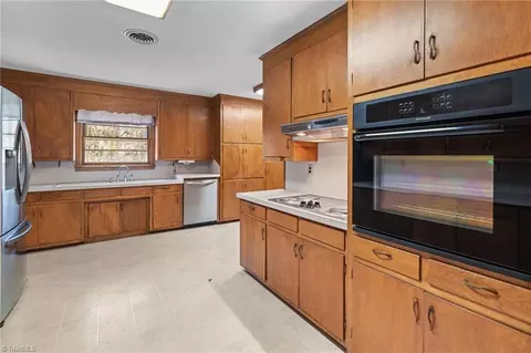 Kitchen - 407 Pinecroft Ln, Spencer, NC 28159 photo 3 of 5