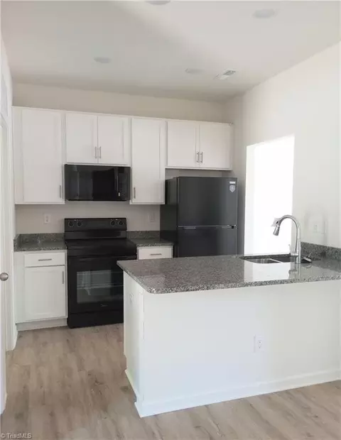 Kitchen - 801 Commerce Ave E, High Point, NC 27260 photo 1 of 2