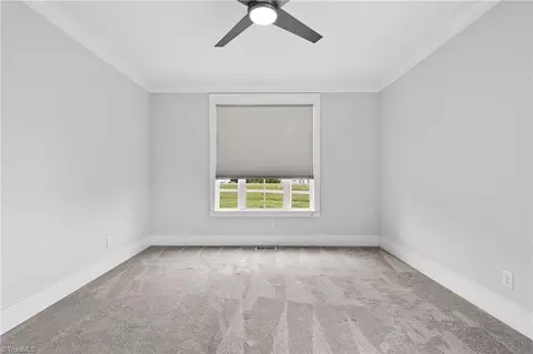 Bedroom - 8403 Wolf Ridge Trl, Oak Ridge, NC 27310 photo 10 of 10