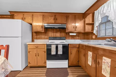 Kitchen - 201 N Holt St, Pine Level, NC 27568 photo 2 of 4