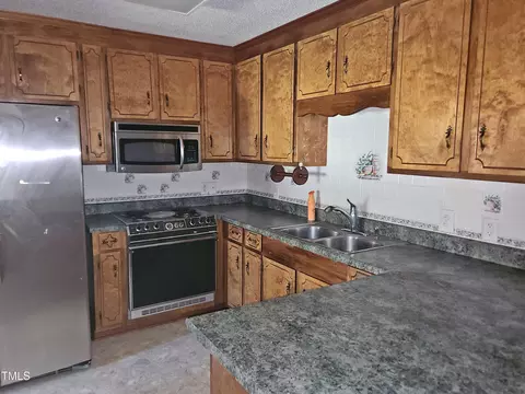 Kitchen - 109 Oak St, Pine Level, NC 27568 photo 2 of 3