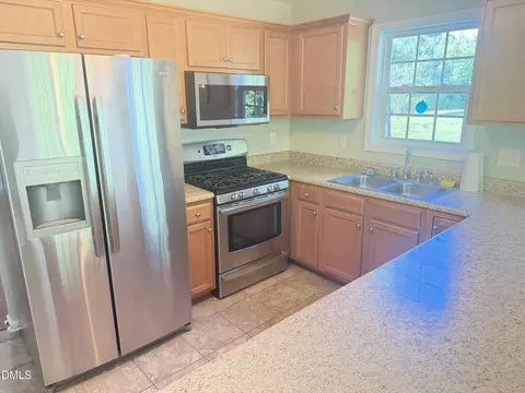Kitchen - 292 Buckhaven Dr, Willow Spring, NC 27592 photo 2 of 3