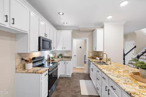 Kitchen - 711 Midsummer Ln, Apex, NC 27502 photo 6 of 10