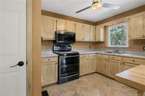 Kitchen - 237 Lemuel Black Rd, Bunnlevel, NC 28323 photo 2 of 7