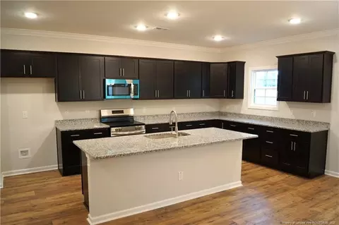 Kitchen - 123 Nectar Ln, Bunnlevel, NC 28323 photo 11 of 12