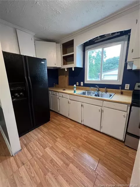Kitchen - 216 E Stack St, Saint Pauls, NC 28384 photo 1 of 2