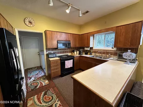 Kitchen - 601 Cordgrass Rd, Hampstead, NC 28443 photo 2 of 3
