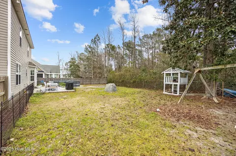Exterior - 129 Pebble Beach Dr, Hampstead, NC 28443 photo 6 of 7