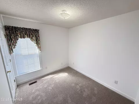 Bedroom - 122 Tarheel Dr, Mount Olive, NC 28365 photo 3 of 4