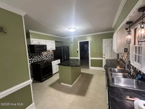 Kitchen - 313 E 1st Ave, Chadbourn, NC 28431 photo 2 of 2