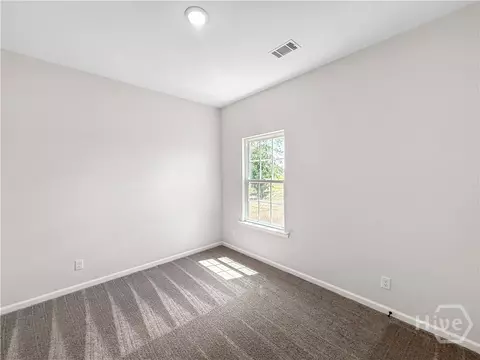 Bedroom - 825 Buckhead Loop SE, Allenhurst, GA 31301 photo 2 of 3