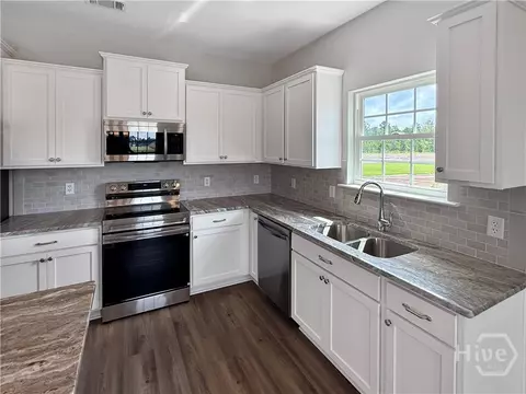 Kitchen - 493 Buckhead Loop SE, Allenhurst, GA 31301 photo 2 of 3