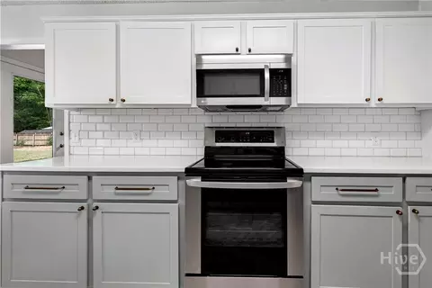Kitchen - 100 E Red Fox Ct, Midway, GA 31320 photo 2 of 4