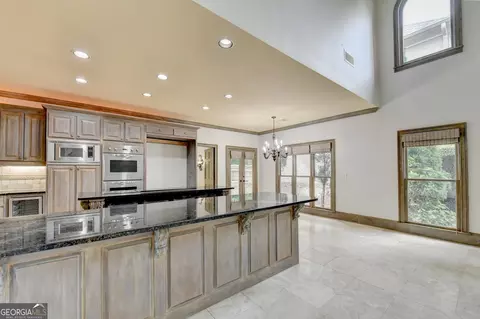 Kitchen - 8385 Royal Melbourne Way, Duluth, GA 30097 photo 8 of 10