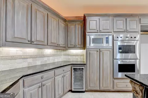 Kitchen - 8385 Royal Melbourne Way, Duluth, GA 30097 photo 6 of 10