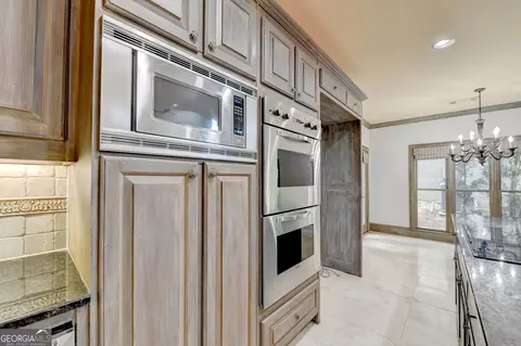 Kitchen - 8385 Royal Melbourne Way, Duluth, GA 30097 photo 7 of 10