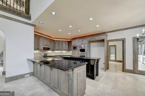 Kitchen - 8385 Royal Melbourne Way, Duluth, GA 30097 photo 10 of 10