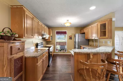 Kitchen - 258 Thomas Rd, Milner, GA 30257 photo 3 of 3