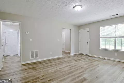 Living - 10592 Marigold Ct, Hampton, GA 30228 photo 10 of 11