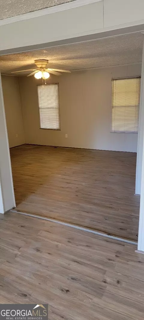 Living - 866 Stallings Rd, Haddock, GA 31033 photo 3 of 3