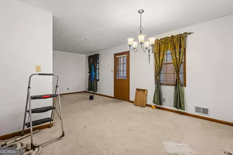 Living - 11800 Pine Needle Ln, Hampton, GA 30228 photo 5 of 5