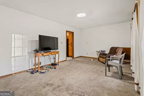 Living - 11800 Pine Needle Ln, Hampton, GA 30228 photo 2 of 5