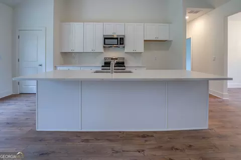 Kitchen - 71 Malcom Rd, Covington, GA 30014 photo 2 of 2