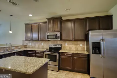 Kitchen - 117 Berkeley Way, Hampton, GA 30228 photo 5 of 5