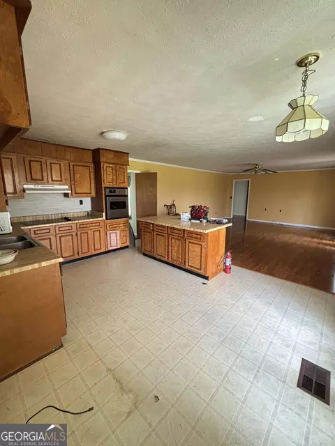 Kitchen - 378 Arena Rd, Perry, GA 31069 photo 2 of 2