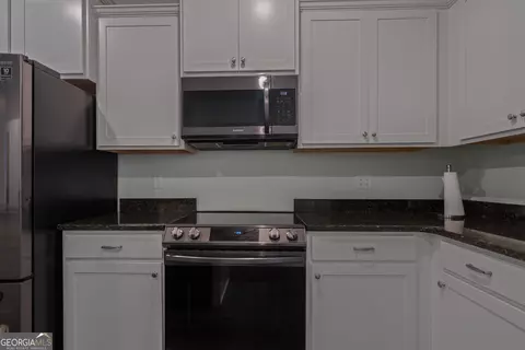 Kitchen - 385 Orchard Ln, Covington, GA 30014 photo 2 of 2