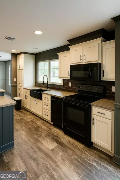 Kitchen - 109 Mann Rd, Barnesville, GA 30204 photo 2 of 3