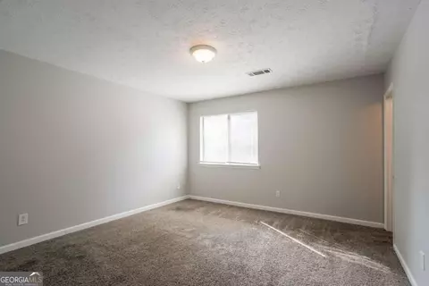 Bedroom - 5404 Biffle Downs Rd, Stone Mountain, GA 30088 photo 8 of 8