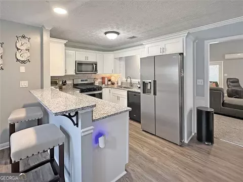 Kitchen - 50 Pebble Brooke Pass, Covington, GA 30016 photo 2 of 2