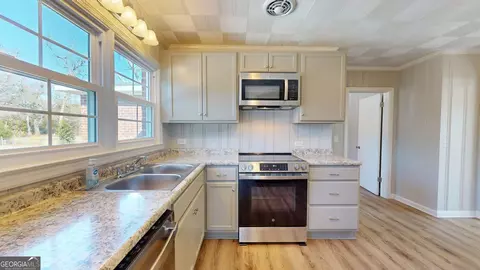 Kitchen - 207 Dixie St, Brooklet, GA 30415 photo 2 of 3
