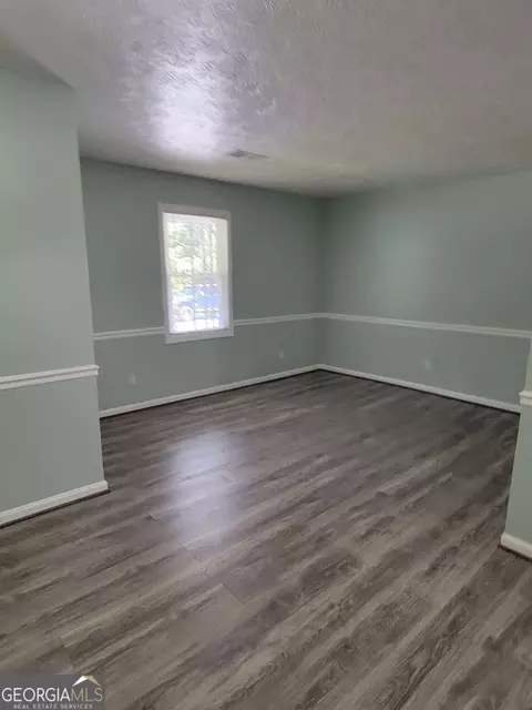 Living - 4648 Pine Tree Cir #B, Buford, GA 30518 photo 2 of 3