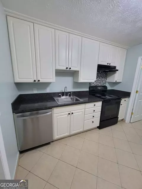 Kitchen - 4648 Pine Tree Cir #B, Buford, GA 30518 photo 3 of 3