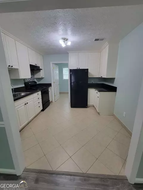 Kitchen - 4648 Pine Tree Cir #B, Buford, GA 30518 photo 2 of 3