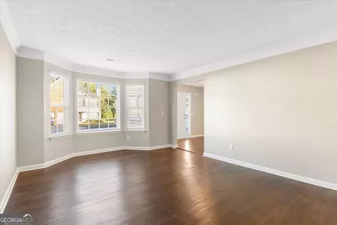 Living - 354 Cobblestone Ct, Hampton, GA 30228 photo 7 of 10