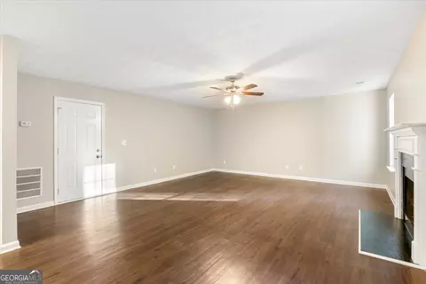 Living - 354 Cobblestone Ct, Hampton, GA 30228 photo 9 of 10