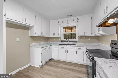 Kitchen - 243 Malcom Rd, Covington, GA 30014 photo 2 of 2