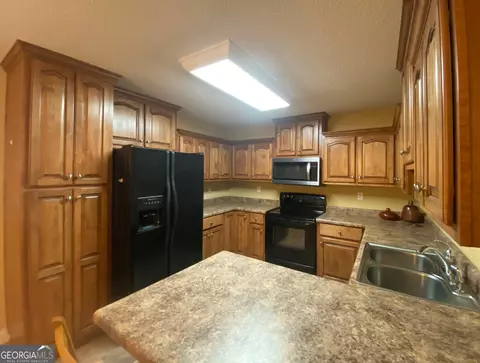 Kitchen - 108 Arnold St, Centerville, GA 31028 photo 2 of 2