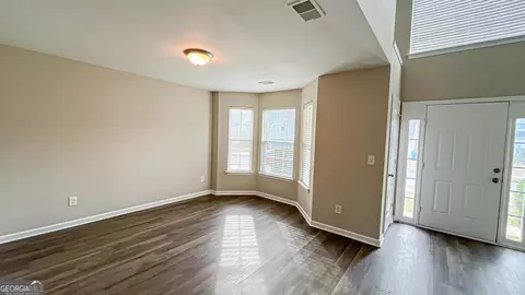 Living - 1106 Oak Hollow Ln, Hampton, GA 30228 photo 2 of 4